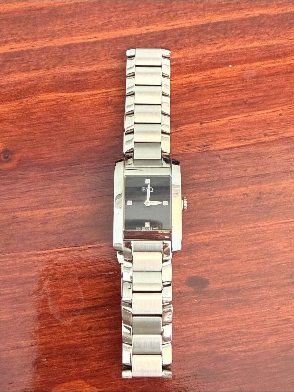 Womenโs Silver Stainless Steel Rectangle Watch with Black Dial